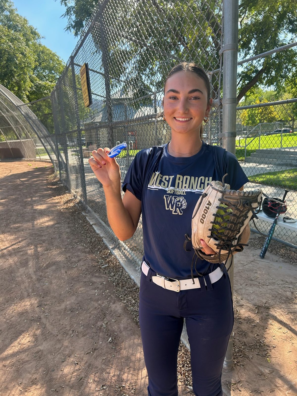 Athlete on the field with her NeuroGuard+ mouthguard